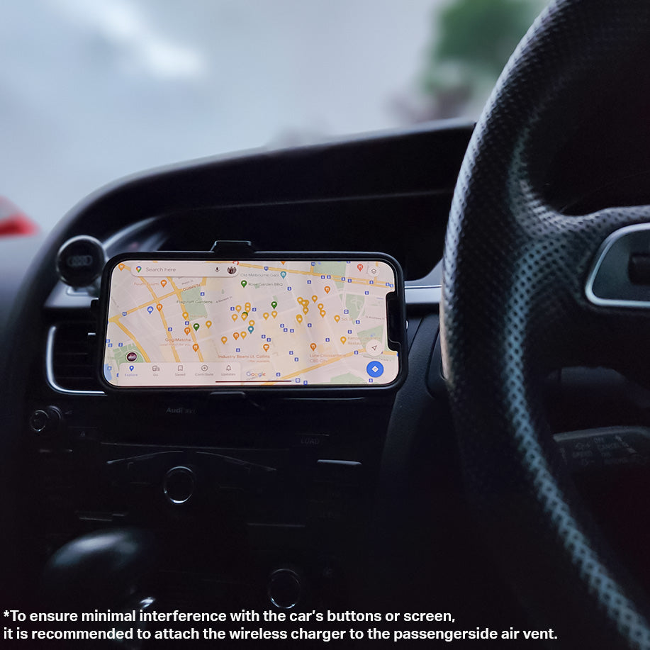 The Urban Auto15 Universal Wireless Car Charger Kit dashboard of a car with a gps on it.