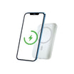 A smartphone with a green charging symbol on the screen is positioned next to a rectangular wireless charger, utilizing the convenience of an Urban MagPower10 Wireless Powerbank.